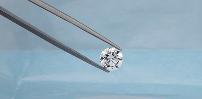 diamond in tweezers